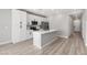 Spacious kitchen featuring quartz countertops, stainless steel appliances, white cabinets and an island at 3232 Lahontan St, North Las Vegas, NV 89032