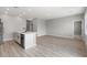 Bright open-concept living room featuring durable floors, neutral paint, recessed lighting, and lots of natural light at 3232 Lahontan St, North Las Vegas, NV 89032