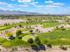 Beautiful aerial scene of the neighborhood golf course and mountain views at 350 S Durango Dr # 108, Las Vegas, NV 89145