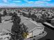 Overhead view of an apartment complex highlighting the city skyline in the distance, under a blue sky with white clouds at 350 S Durango Dr # 108, Las Vegas, NV 89145