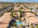 Community aerial view showcasing palm trees and lush landscaping surrounding the pool area at 350 S Durango Dr # 108, Las Vegas, NV 89145