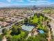 A picturesque view showcasing the neighborhood's community tennis courts and extensive landscaping at 350 S Durango Dr # 108, Las Vegas, NV 89145