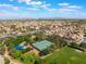 Scenic aerial photograph showcases neighborhood tennis courts, lush green spaces, and community park at 350 S Durango Dr # 108, Las Vegas, NV 89145