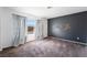Spacious bedroom with ample natural light, neutral walls, and comfortable carpeting at 350 S Durango Dr # 108, Las Vegas, NV 89145