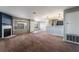 Comfortable carpeted living room with a minimalist fireplace, neutral colors, and natural light creating an inviting space at 350 S Durango Dr # 108, Las Vegas, NV 89145