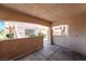 Covered patio offering views of the community's landscaped pathways and buildings at 350 S Durango Dr # 108, Las Vegas, NV 89145