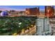Striking aerial view showcasing the Las Vegas skyline, golf course, and modern building architecture at dusk at 360 E Desert Inn Rd # 1901, Las Vegas, NV 89109