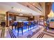 Modern bar with custom cabinetry, seating, and a sleek design perfect for entertaining guests at 360 E Desert Inn Rd # 1901, Las Vegas, NV 89109