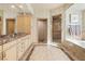 Bright bathroom with a double vanity, walk-in shower, and separate tub offers modern convenience at 360 E Desert Inn Rd # 1901, Las Vegas, NV 89109