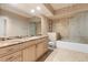 Elegant bathroom featuring a tub, marble countertop, patterned accent wall, and modern fixtures at 360 E Desert Inn Rd # 1901, Las Vegas, NV 89109