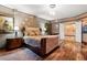 Comfortable bedroom with a plush bed, accent lighting, an en suite bathroom, and hardwood floors at 360 E Desert Inn Rd # 1901, Las Vegas, NV 89109