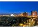 Incredible nighttime cityscape view featuring iconic Las Vegas landmarks and a lush green golf course at 360 E Desert Inn Rd # 1901, Las Vegas, NV 89109
