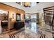 Open foyer with marble floors leads to the living area and modern staircase, highlighting the home's design at 360 E Desert Inn Rd # 1901, Las Vegas, NV 89109