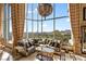 Elegant living room featuring floor-to-ceiling windows with city views, stylish decor, and luxurious seating at 360 E Desert Inn Rd # 1901, Las Vegas, NV 89109