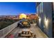 Outdoor patio with seating area and stunning night time city views at 360 E Desert Inn Rd # 1901, Las Vegas, NV 89109