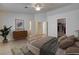 Serene bedroom with a large bed, stylish furnishings, and ample natural light, creating a relaxing retreat at 3832 Alder Creek Ct, North Las Vegas, NV 89032