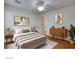 Inviting bedroom featuring neutral decor, modern furniture, and warm wood floors, creating a peaceful retreat at 3832 Alder Creek Ct, North Las Vegas, NV 89032