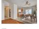 Open floor plan with a dining area featuring a table for four near the kitchen and backyard access at 3832 Alder Creek Ct, North Las Vegas, NV 89032