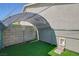 Enclosed dog run with artificial grass, offering a safe and fun outdoor space for pets at 3832 Alder Creek Ct, North Las Vegas, NV 89032