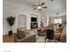 An open-concept living room with abundant natural light and wood floors throughout at 3832 Alder Creek Ct, North Las Vegas, NV 89032