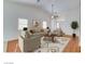 Bright living room boasting neutral tones, a vaulted ceiling, and wood floors at 3832 Alder Creek Ct, North Las Vegas, NV 89032