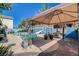 Poolside view with shaded gazebo offers the perfect spot to relax and enjoy the backyard's aquatic fun at 3832 Alder Creek Ct, North Las Vegas, NV 89032