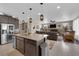Stylish kitchen with a large island, stainless steel appliances, and open flow to the living space; perfect for entertaining at 40 Vicolo Della Luna, Henderson, NV 89011