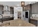 Kitchen featuring granite counters, stainless fridge and sizable pantry at 40 Vicolo Della Luna, Henderson, NV 89011