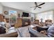 Comfortable living room with a fireplace and a large window at 40 Vicolo Della Luna, Henderson, NV 89011