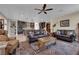 Open-concept living room with a large sofa and access to the kitchen at 40 Vicolo Della Luna, Henderson, NV 89011