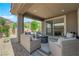 Relaxing covered patio with comfortable seating and a fire pit for outdoor enjoyment at 40 Vicolo Della Luna, Henderson, NV 89011