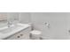 Clean half bathroom features modern fixtures, white vanity, and toilet at 4246 W Landberg Ave, Las Vegas, NV 89141