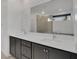 Bright bathroom with dual vanities, quartz countertops, and a frameless shower at 4246 W Landberg Ave, Las Vegas, NV 89141