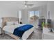 Inviting bedroom with a tufted headboard, plush bedding, and ample natural light creates a serene retreat at 4246 W Landberg Ave, Las Vegas, NV 89141