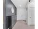 Contemporary entryway with tile flooring, decorative wall, and storage cabinet at 4246 W Landberg Ave, Las Vegas, NV 89141