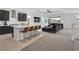 Open kitchen featuring a large island with seating, and a view of the living room at 4246 W Landberg Ave, Las Vegas, NV 89141