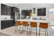 Modern kitchen with dark cabinetry, stainless steel appliances, and a spacious island at 4246 W Landberg Ave, Las Vegas, NV 89141
