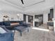 Open-concept living area with a kitchen, stairs, and stylish decorations at 4246 W Landberg Ave, Las Vegas, NV 89141