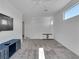 Bright living room featuring gray carpet, ample natural light, and sleek furniture creates a relaxing, modern feel at 4246 W Landberg Ave, Las Vegas, NV 89141