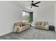 Bright living room features neutral paint, carpeted floors, and comfortable sofas at 4246 W Landberg Ave, Las Vegas, NV 89141