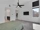 Main bedroom featuring ceiling fan and flat screen with an ensuite bathroom at 4246 W Landberg Ave, Las Vegas, NV 89141