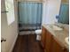 Bright bathroom featuring a double vanity and a shower/tub combo at 4554 Townwall St, Las Vegas, NV 89115