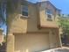 Home featuring an attached two-car garage and neutral color scheme at 4554 Townwall St, Las Vegas, NV 89115