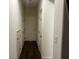 Hallway with wood floors and white doors at 4554 Townwall St, Las Vegas, NV 89115