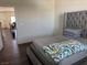 Comfortable main bedroom with a gray upholstered bed at 4554 Townwall St, Las Vegas, NV 89115