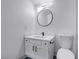This renovated bathroom features a black-accented mirror and modern fixtures at 4571 Sirius Ave, Las Vegas, NV 89102