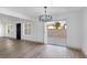 The living room features hardwood floors, modern lighting, and a sliding glass door leading to an outdoor patio at 4571 Sirius Ave, Las Vegas, NV 89102