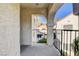 Open balcony with decorative concrete archway offers views of the community and nearby buildings at 4860 Nara Vista Way # 204, Las Vegas, NV 89103