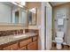Well-lit bathroom featuring granite countertop vanity and tiled floors at 4860 Nara Vista Way # 204, Las Vegas, NV 89103