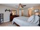 Bright bedroom featuring a ceiling fan, dresser, and spacious walk in closet at 4860 Nara Vista Way # 204, Las Vegas, NV 89103